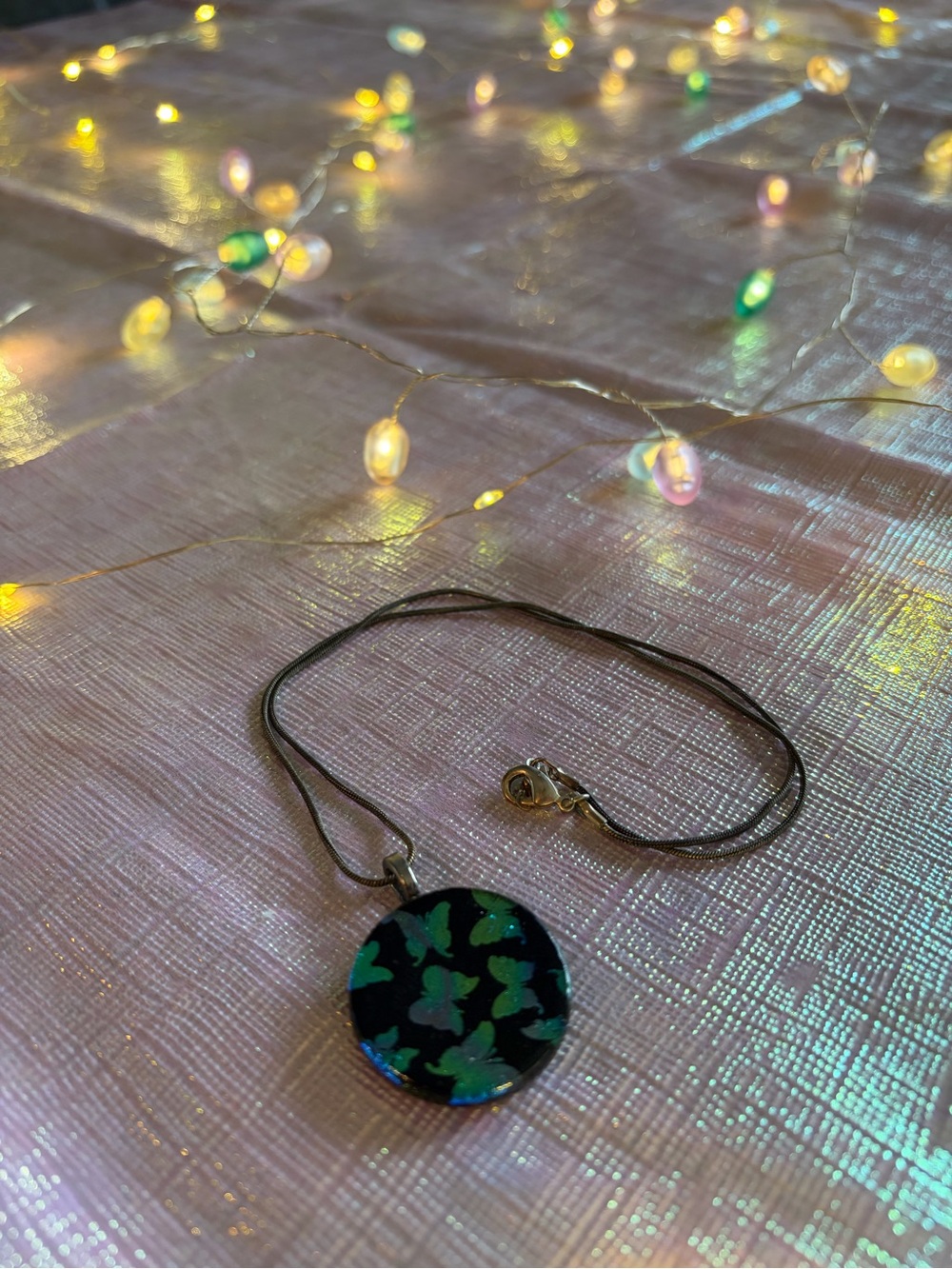 Black Round Pendant Necklace with Green Iridescent Butterfly Design